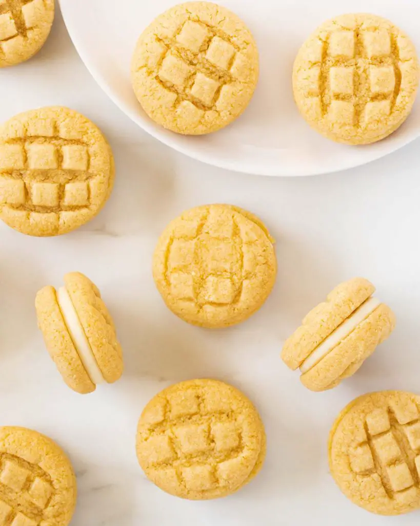 My custard cream biscuits are a total DREAM! Melt in your mouth biscuits sandwiched with a creamy dreamy buttercream filling, these will never hang around long! Recipe by movers and bakers