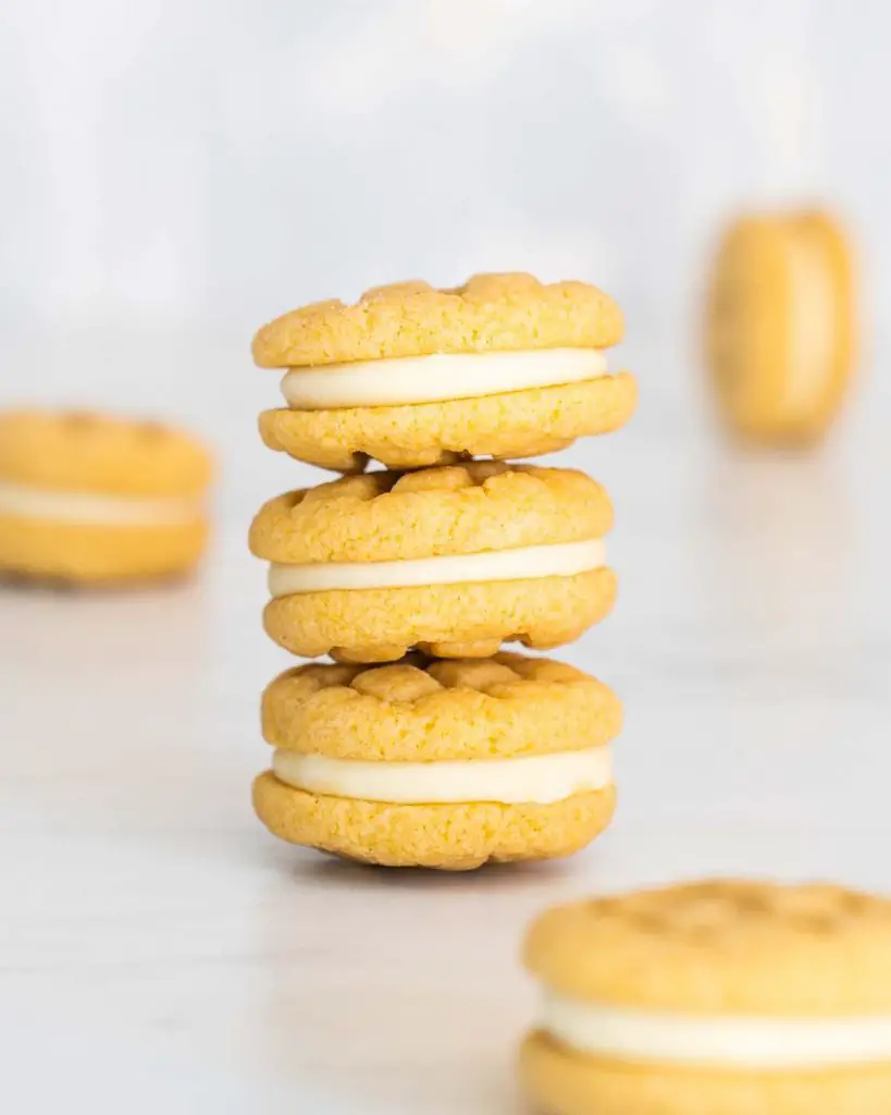 My custard cream biscuits are a total DREAM! Melt in your mouth biscuits sandwiched with a creamy dreamy buttercream filling, these will never hang around long! Recipe by movers and bakers