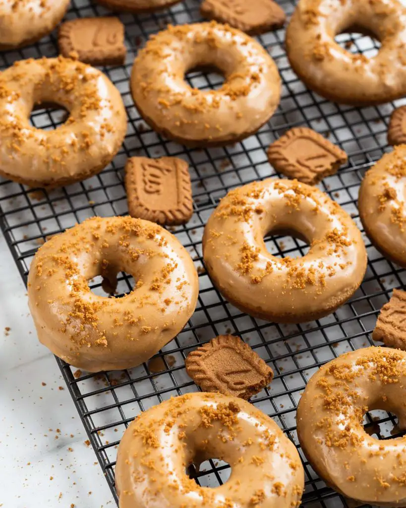 These donuts are quick to make, and dunked in a gorgeous Biscoff glaze. Yum! Recipe by movers and bakers 