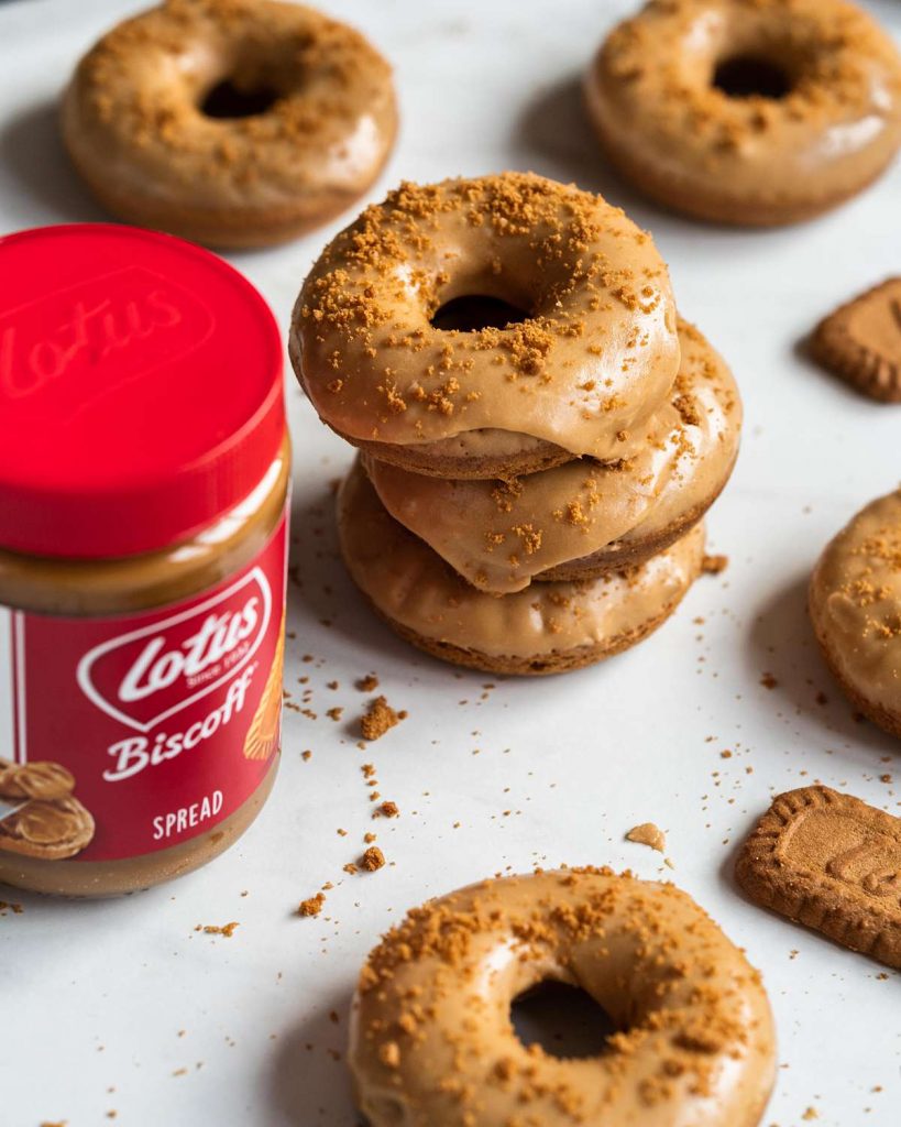 My Biscoff donuts are quick, fluffy and dunked in a gorgeous Biscoff glaze. Yum! Recipe by movers and bakers 