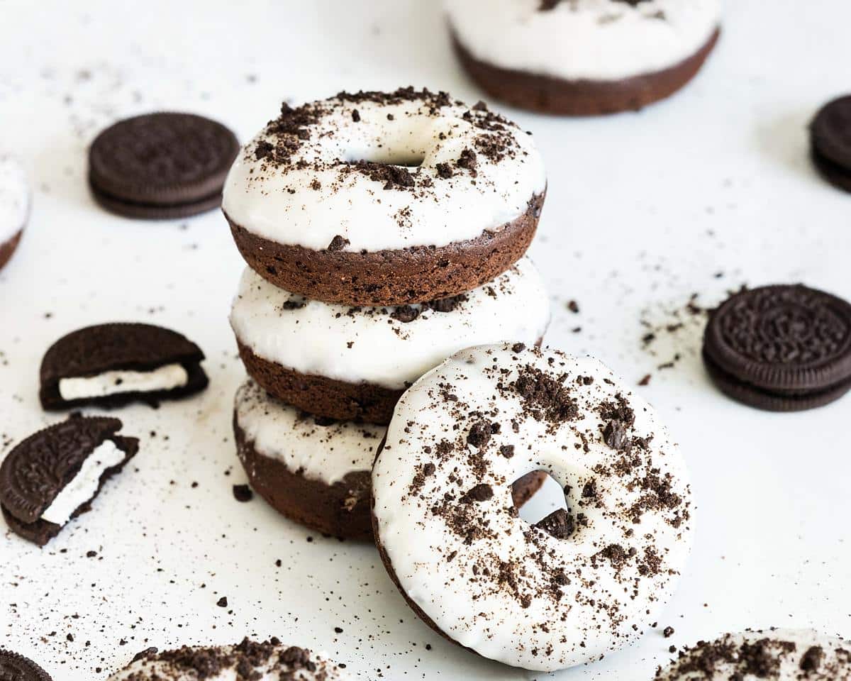 Delicious cakey, chocolatey Oreo donuts are light and delicious, topped with a yummy tangy cream cheese glaze. Recipe by movers and bakers
