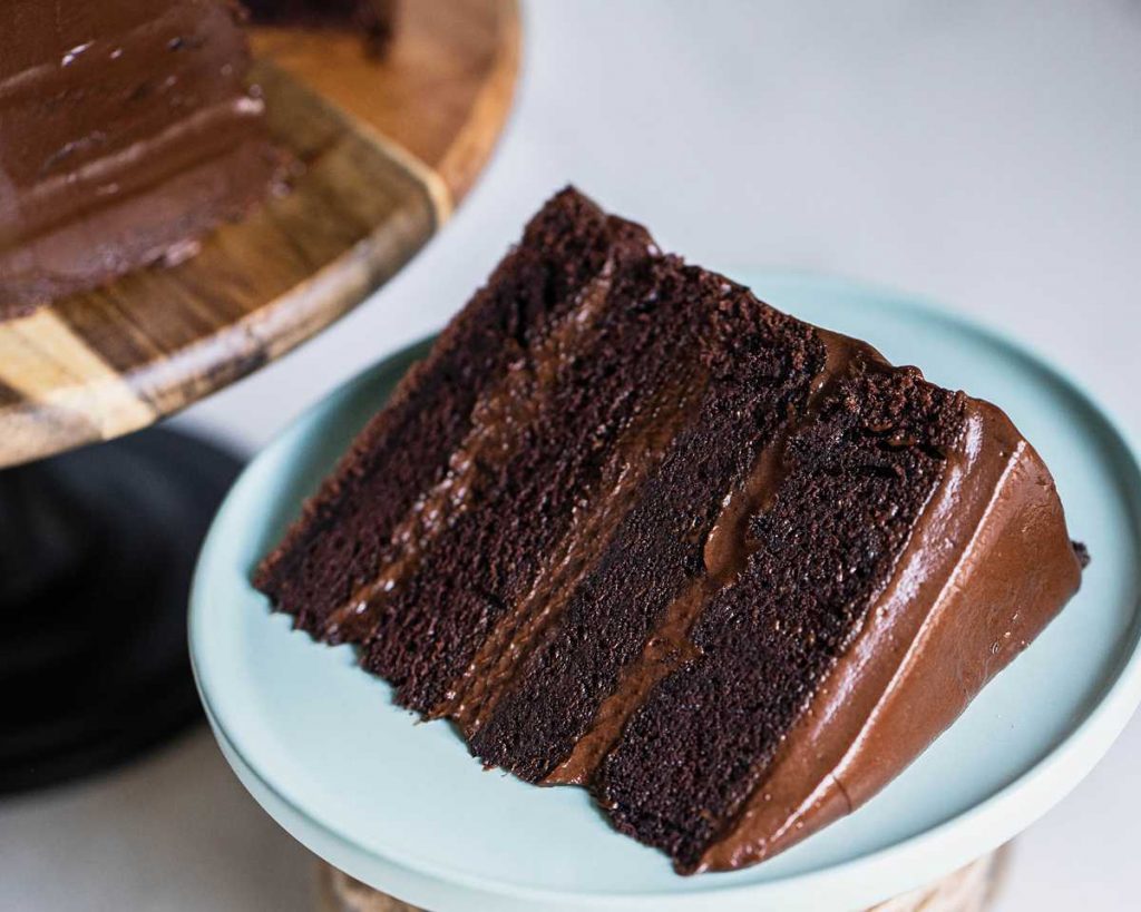 Chocolate fudge cake. This choc fudge cake recipe is the only one you will ever need! Four layers of rich and moist chocolate cake filled and covered with the most wonderfully decadent chocolate fudge frosting. Completely irresistible! Recipe by movers and bakers