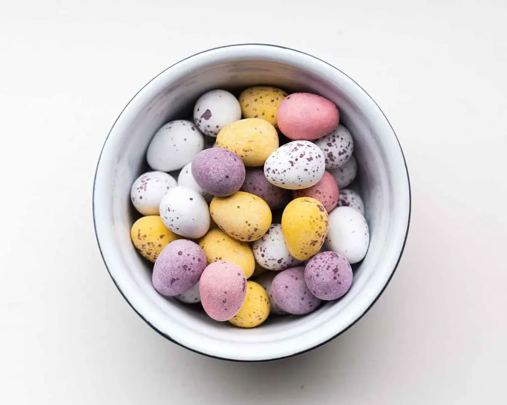 A bowl of mini eggs ready to use in my mini egg fudge. A quick and easy three ingredient fudge. Perfect seasonal treat! Recipe by movers and bakers