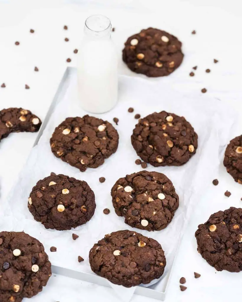 These triple chocolate cookies are chunky and chewy and cram packed with lots of beautiful melting chocolate chips. Recipe by movers and bakers