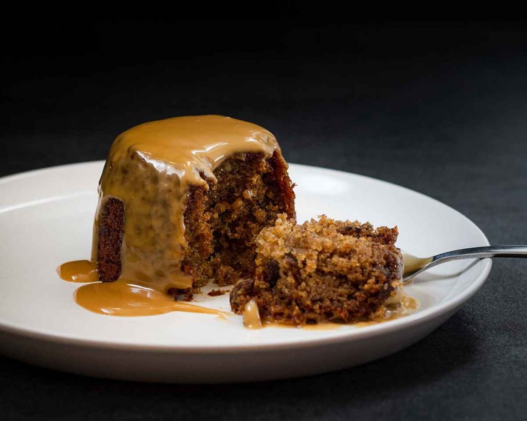 Easy sticky toffee pudding. Rich date sponge and lashings of toffee sauce make this a winter warmer everyone loves! Recipe by movers and bakers