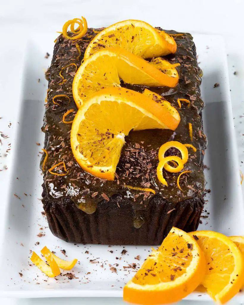 A rich, deep chocolate & orange cake packed with beautiful flavours and smothered with a beautiful marmalade glaze. Recipe by movers & bakers