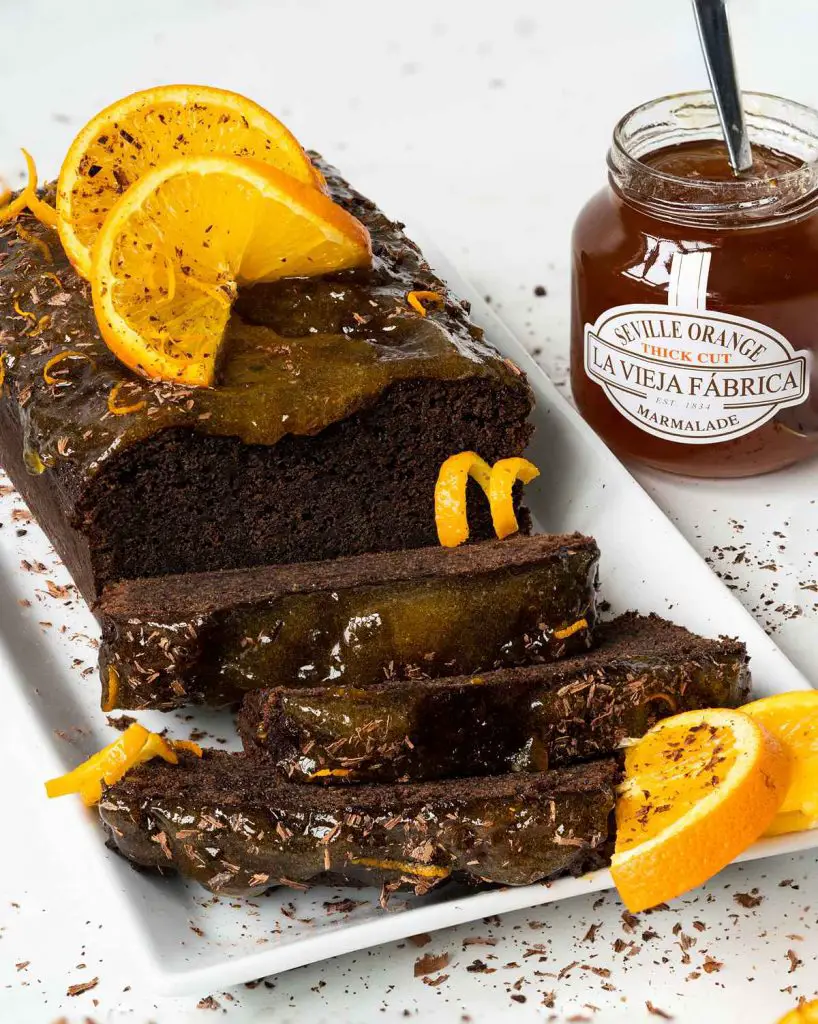 A rich, deep chocolate & orange cake packed with beautiful flavours and smothered with a beautiful marmalade glaze. Recipe by movers & bakers