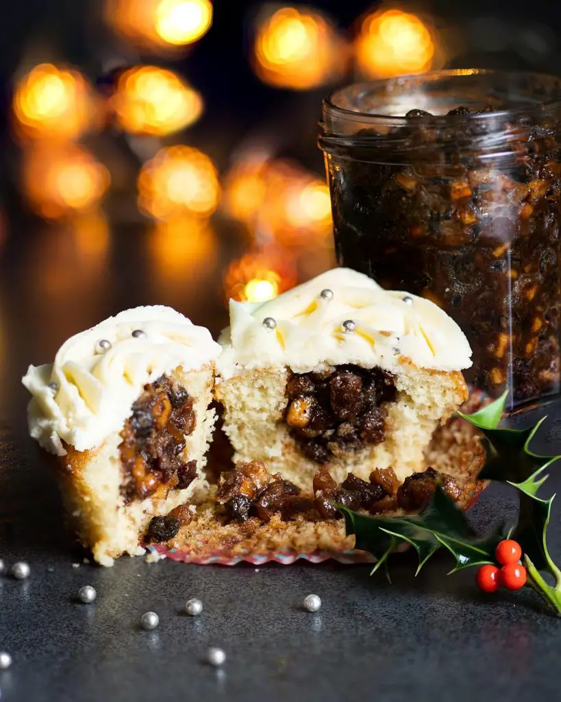 Mince pie cupcakes. Moist vanilla cupcakes, filled generously with boozy homemade mincemeat and topped with a stunning brandy buttercream. Recipe by movers and bakers