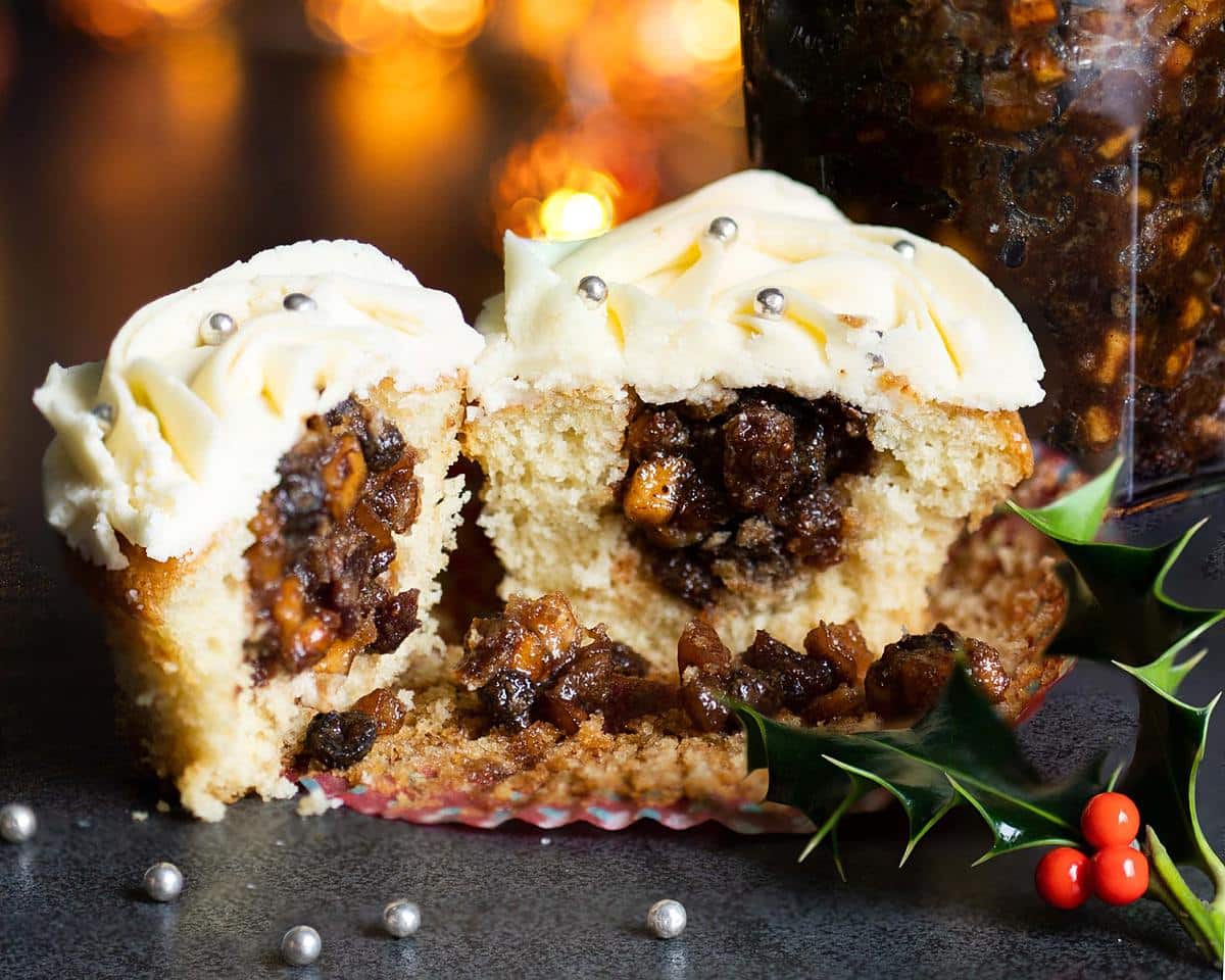 Mince pie cupcakes. Moist vanilla cupcakes, filled generously with boozy homemade mincemeat and topped with a stunning brandy buttercream. Recipe by movers and bakers