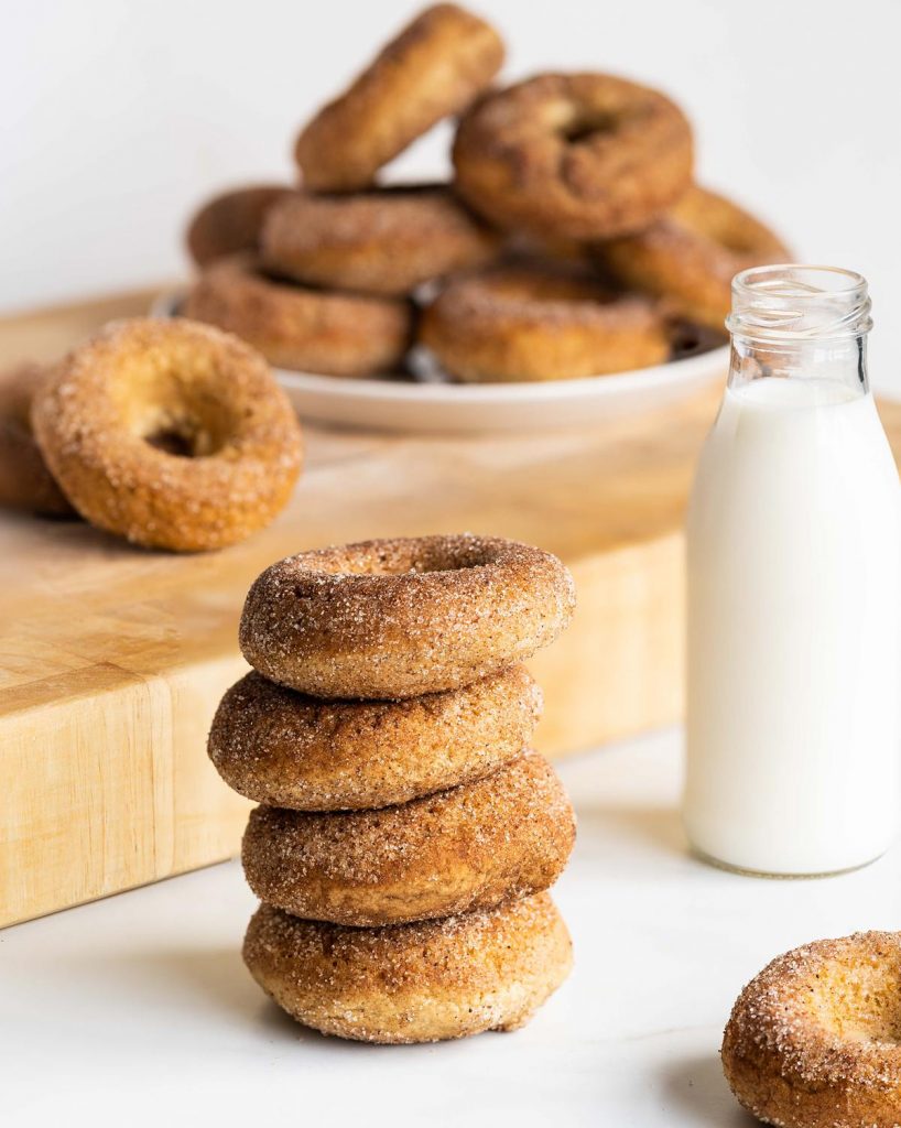These donuts are best enjoyed with a cold glass of milk. Perfect for baking with kids! #moversandbakers #egglessdonuts #cinnamonsugardonuts #recipeforegglessdonuts