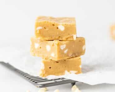 A stack of fudgy chewy white chocolate blondies