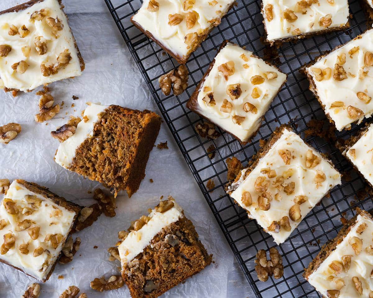 carrot cake tray bake with walnuts and lashings of cream cheese icing. Recipe by movers and bakers