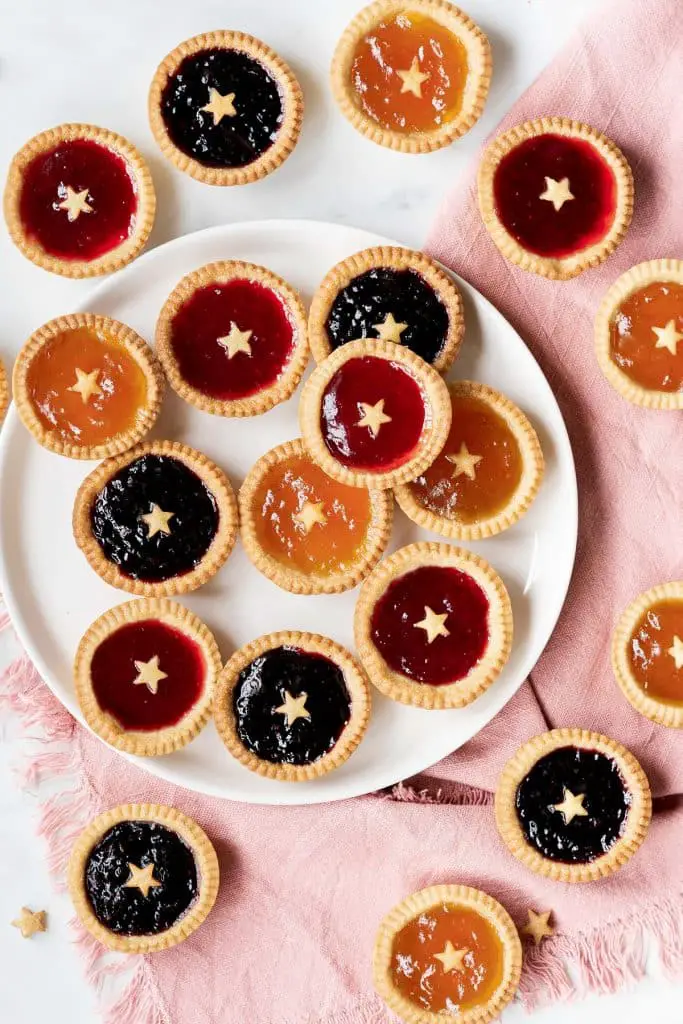 Mini jam tarts. Beautiful buttery shortcrust pastry shells filled with delicious jam. And don't forget the little pastry star! Recipe by movers and bakers