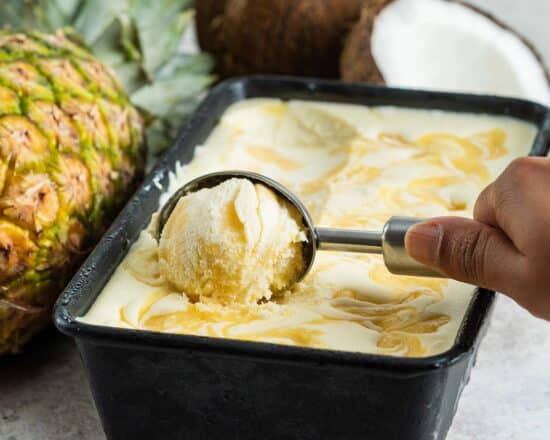 Pineapple coconut ice cream. Remember to leave the ice cream out for about 10 minutes to soften before scooping! Recipe by movers and bakers