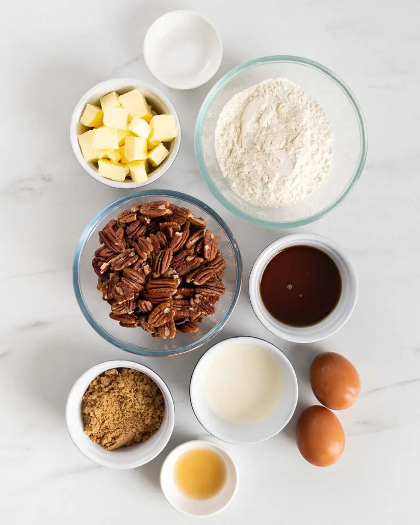 Ingredients needed: plain (all purpose) flour, brown sugar, salt, vanilla, unsalted butter, maple syrup, double (heavy) cream, pecan nuts and eggs. Recipe by movers and bakers