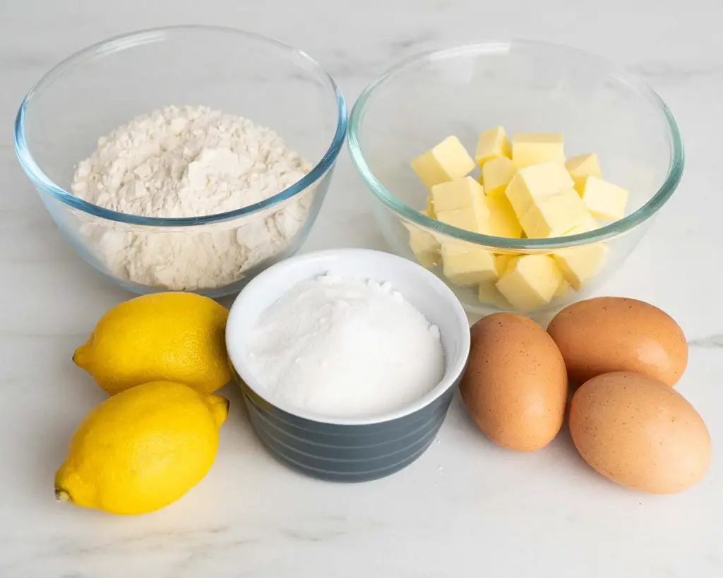 Ingredients for the cake: lemon zest, unsalted butter, eggs, caster sugar and self raising flour. Recipe by movers and bakers