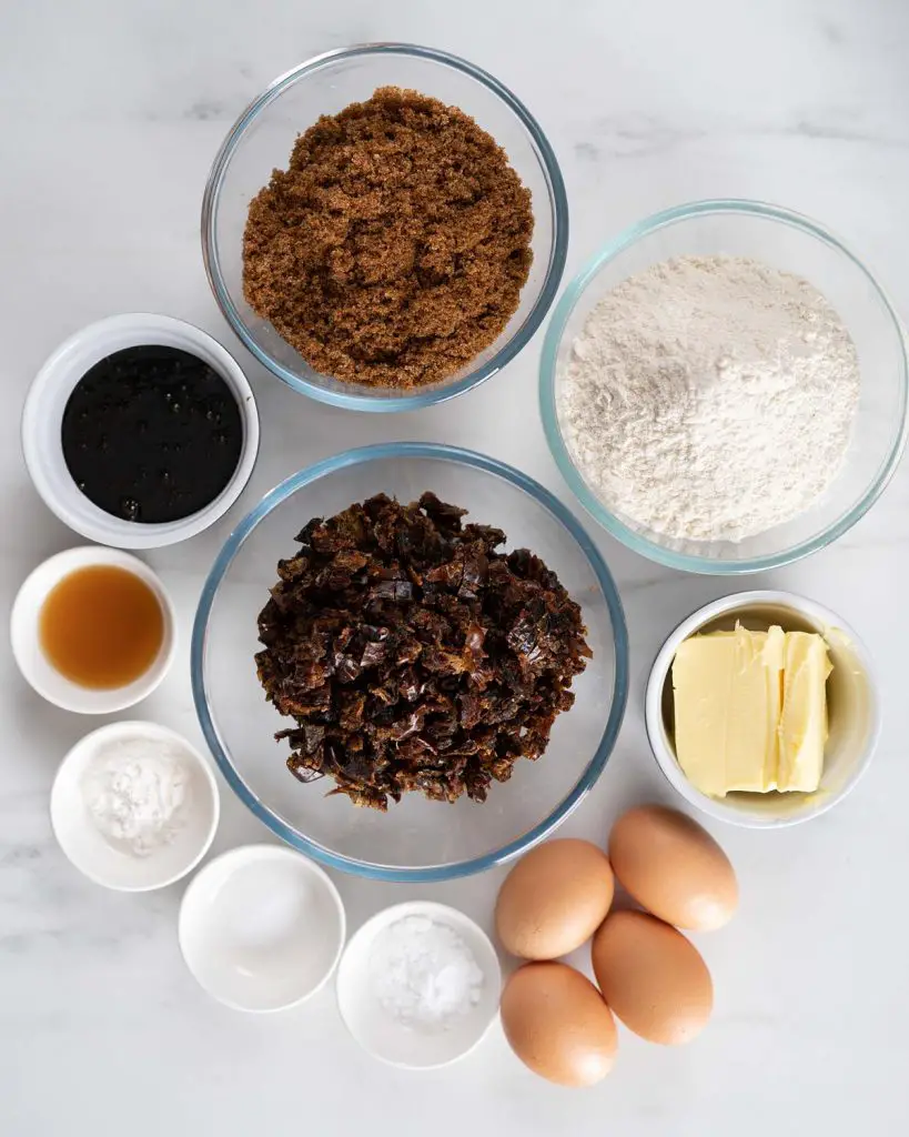 Ingredients required for the cake: dates, bicarbonate of soda (baking soda), unsalted butter, dark brown sugar, treacle (molasses), vanilla, eggs, plain (all purpose) flour, baking powder and salt. Recipe by movers and bakers