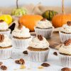 Pumpkin Spice Cupcakes. These delicious, warming pumpkin cupcakes are so light and fluffy, and are topped with the most incredible maple pecan buttercream! A perfect autumnal bake! Recipe by movers and bakers #pumpkinspicecupcakes #pumpkinspice #autumnbaking #pumpkincupcakes