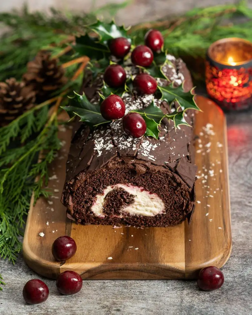 Black Forest yule log. Deeply chocolatey, rich cherries and a perfect balance of cherry liquor, this is one festive bake everyone will love! Recipe by movers and bakers