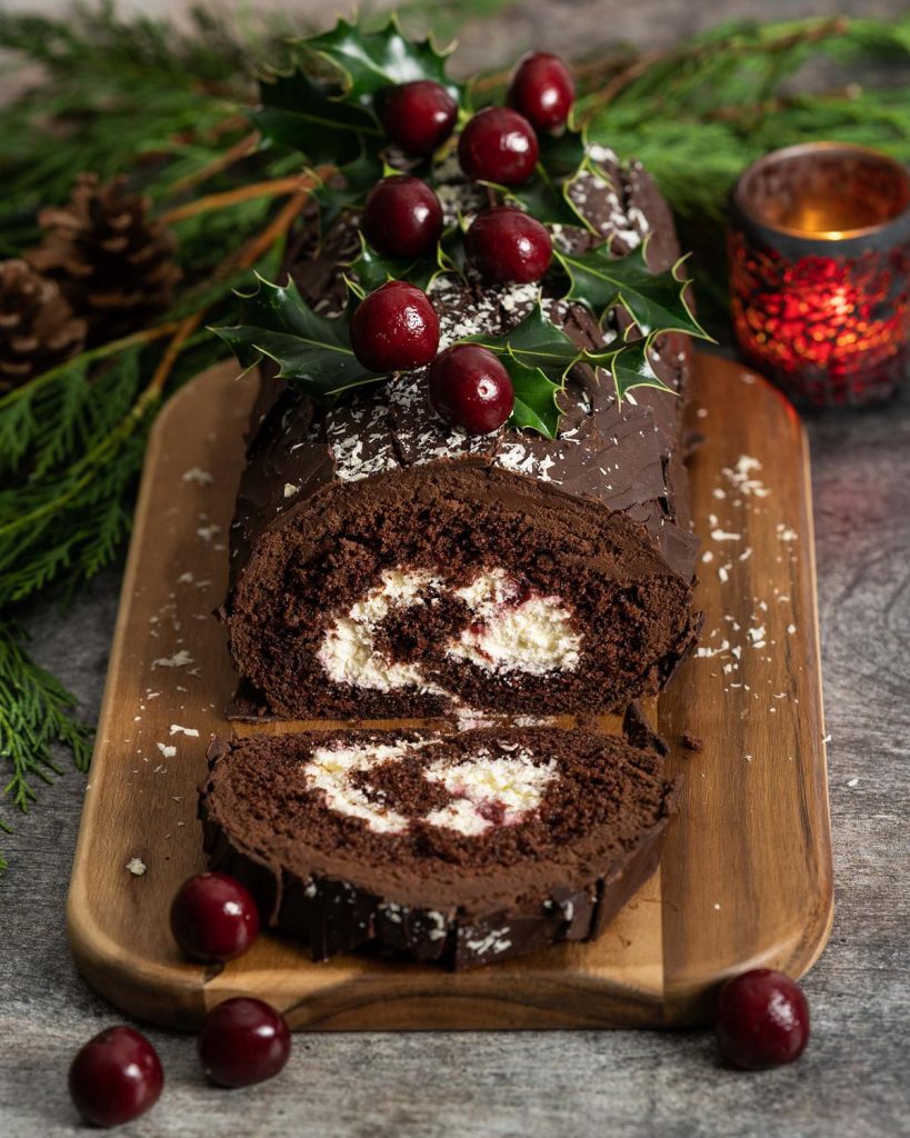 Black Forest yule log. Deeply chocolatey, rich cherries and a perfect balance of cherry liquor, this is one festive bake everyone will love! Recipe by movers and bakers