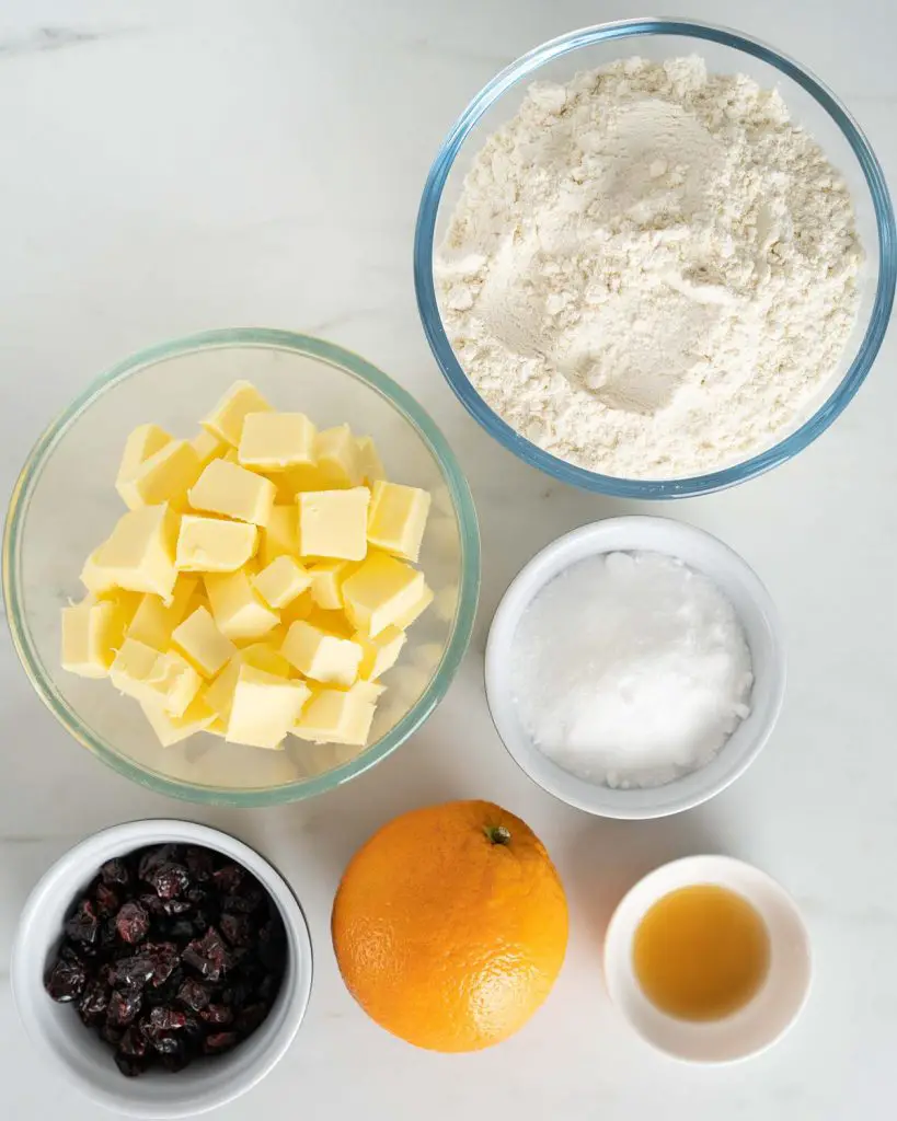 Ingredients required: dried cranberries, orange, unsalted butter, plain flour, caster sugar, vanilla and granulated sugar. Recipe by movers and bakers