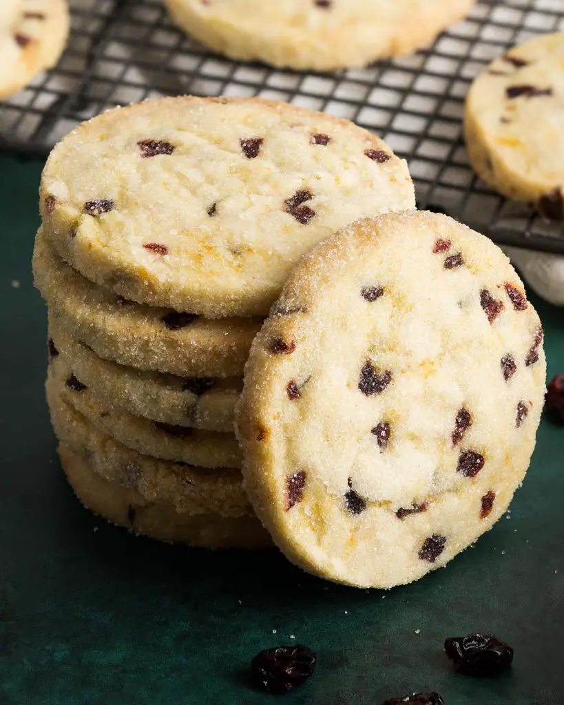 Cranberry orange shortbread cookies. Buttery shortbread packed with fresh orange flavour and pops of cranberries, these disappear as soon as they're out of the oven! Recipe by movers and bakers