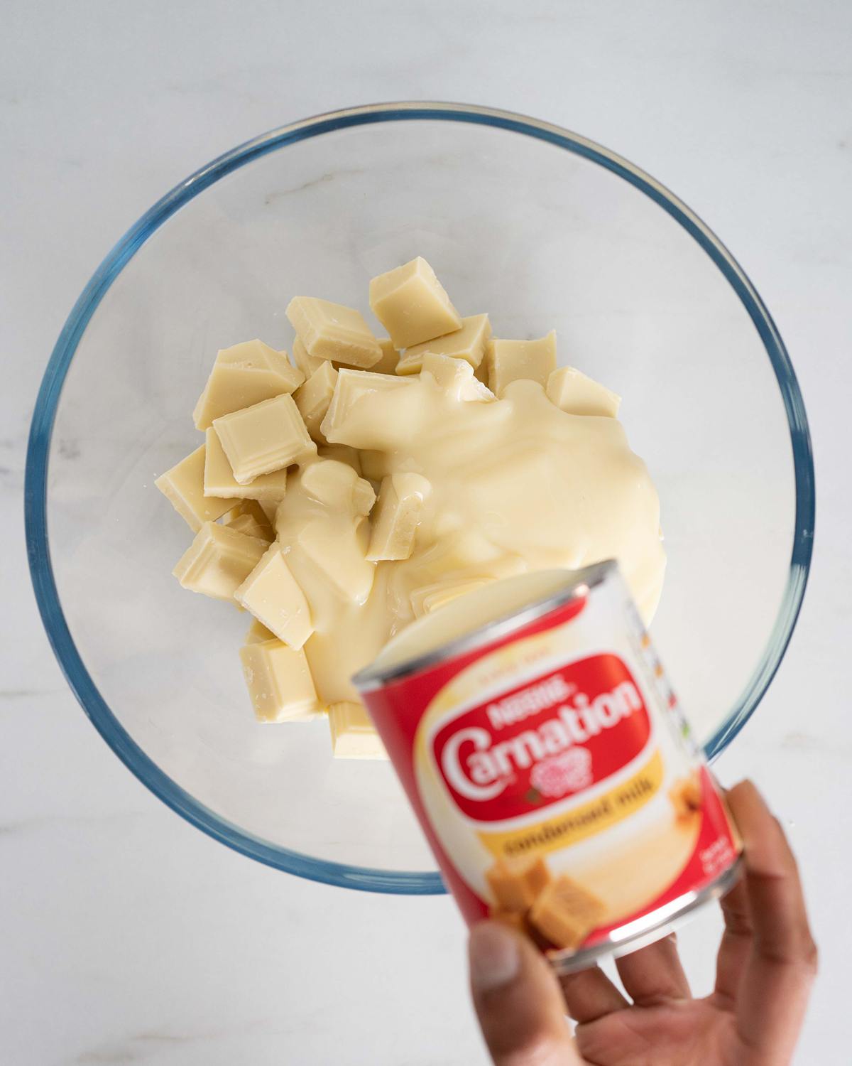 Melt together the white chocolate and condensed milk...