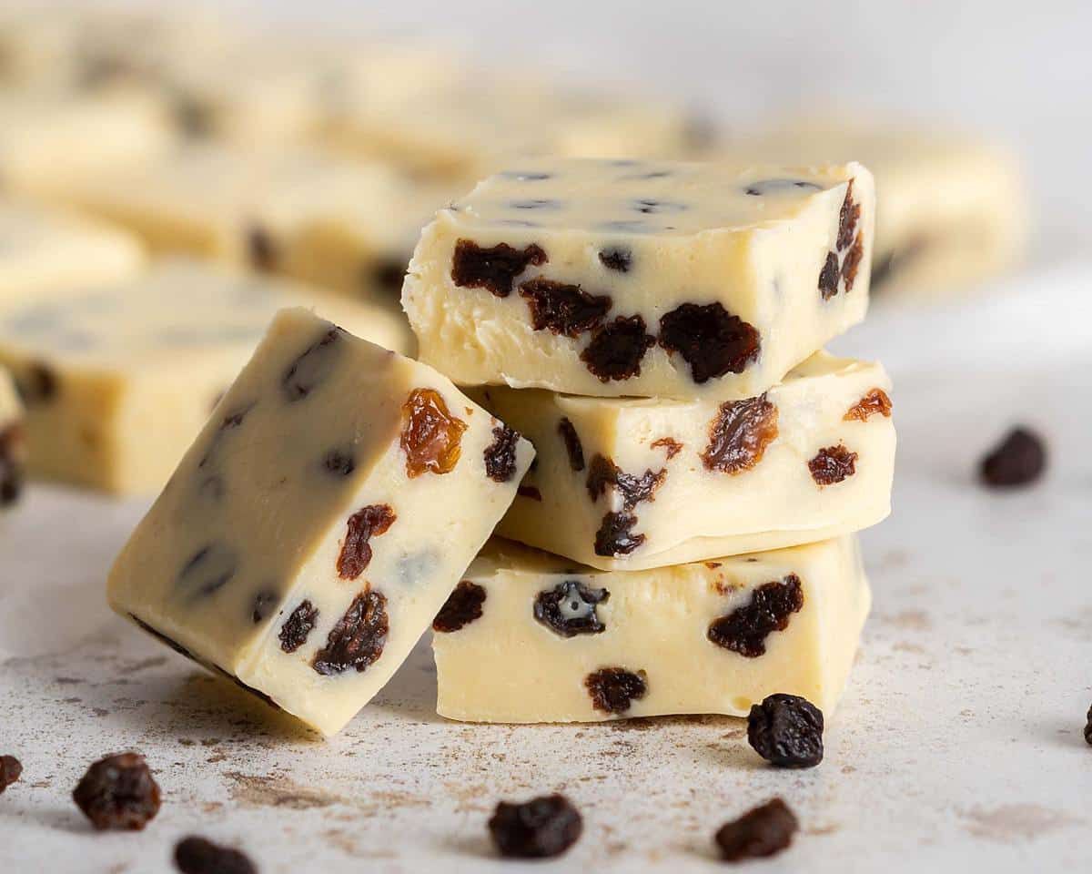 Rum and raisin fudge. A deliciously indulgent quick fudge recipe which comes together in minutes and makes a wonderfully boozy edible gift! Recipe by movers and bakers