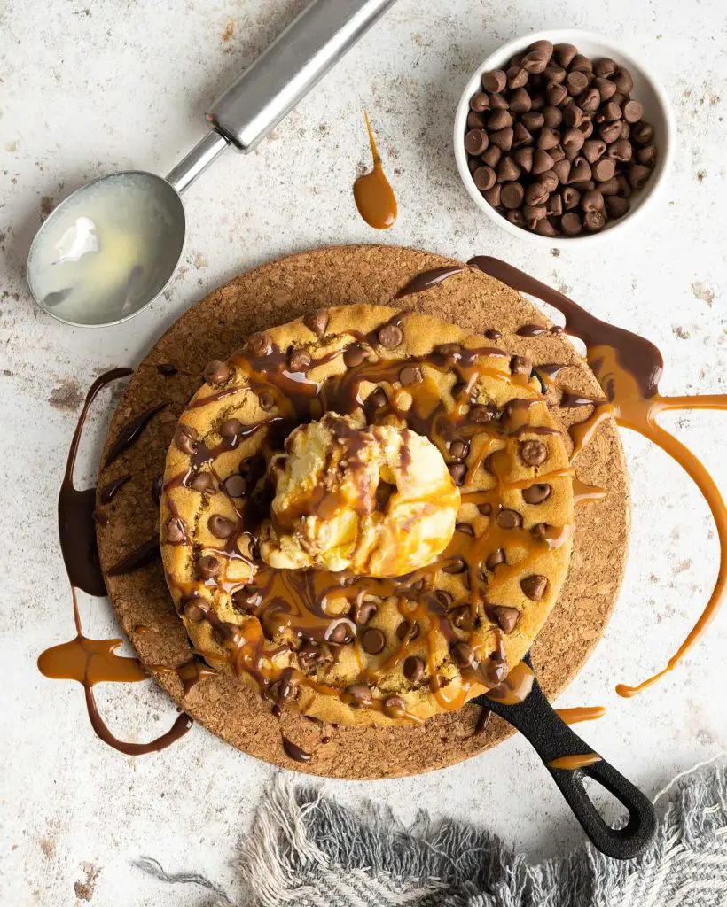 Chocolate chip skillet cookie. Wonderfully crisp on the outside and soft and chewy in the middle. Perfect served with ice cream and lashings of sauce drizzled all over! Recipe by movers and bakers
