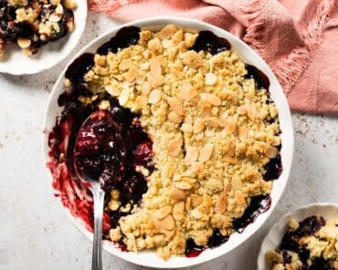 Cherry bakewell crumble. Sweet cherry filling topped with a crisp almond crumble topping makes a wonderful winter warmer dessert. Recipe by movers and bakers