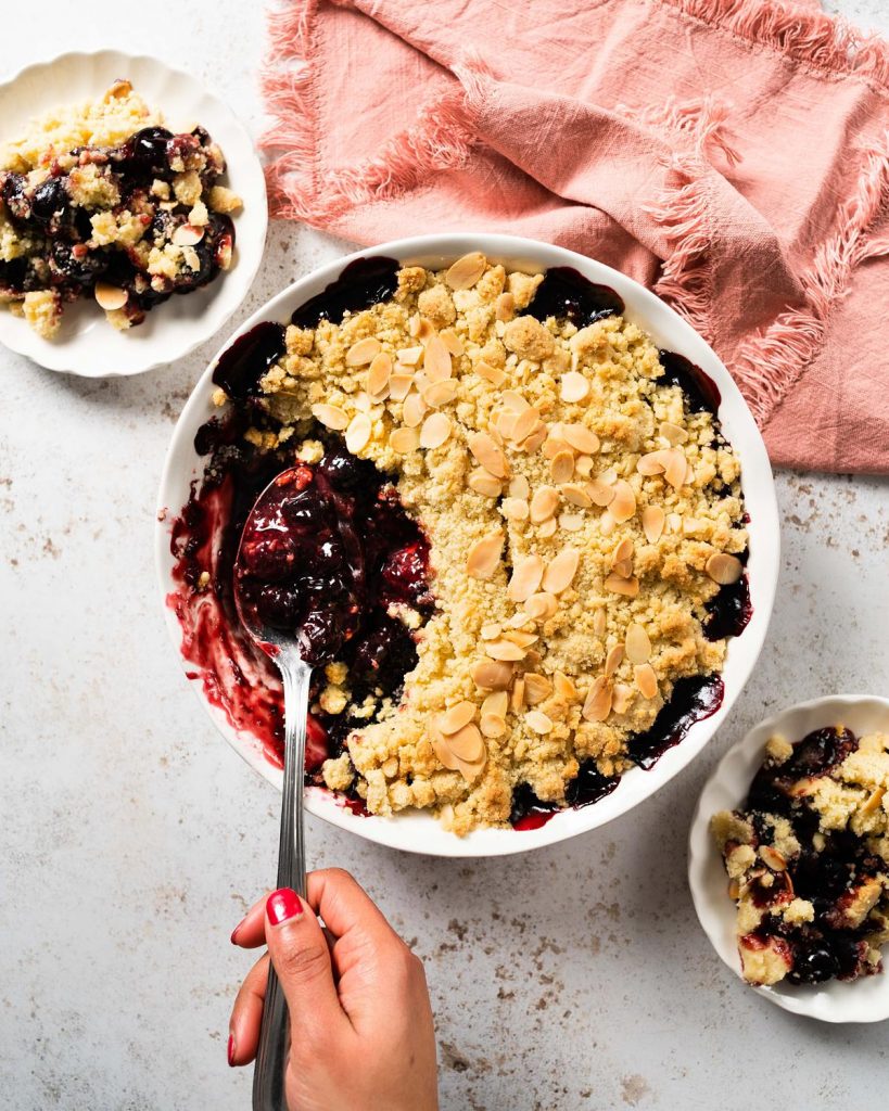 Cherry bakewell crumble. Sweet cherry filling topped with a crisp almond crumble topping makes a wonderful winter warmer dessert. Recipe by movers and bakers