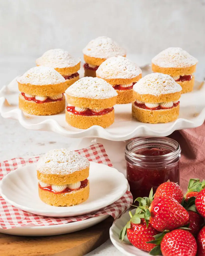Mini Victoria sponge cakes. Light and fluffy mini vanilla sponge cakes, split and filled with strawberry jam and sweet vanilla buttercream before being topped with a generous dusting of icing sugar. Recipe by movers and bakers