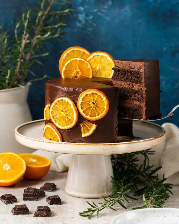 Chocolate orange cake. Rich, decadent and moist, this chocolate orange cake is filled and covered with a dark chocolate orange ganache and decorated with some dehydrated oranges. Simply stunning! Recipe by movers and bakers