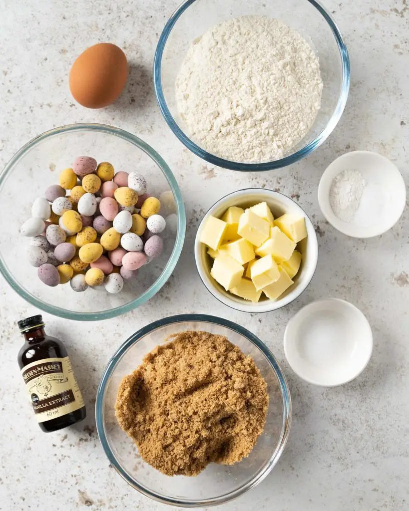 Ingredients required: unsalted butter, brown sugar, egg, vanilla, plain (all purpose) flour, baking powder, bicarbonate of soda (baking soda), salt and mini eggs. Recipe by movers and bakers