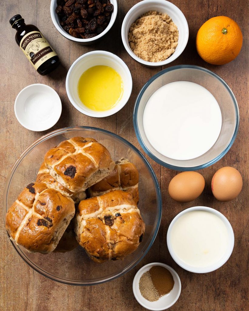 Ingredients required: hot cross buns, milk, double (heavy) cream, eggs, unsalted butter, brown sugar, cinnamon, cardamom powder, vanilla, salt, orange zest and sultanas. Recipe by movers and bakers