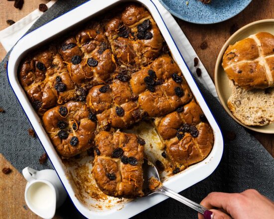 Hot cross bun bread and butter pudding. A mashup recipe featuring yummy Easter buns and a delicious orange spiced custard baked until divine and totally irresistible! Recipe by movers and bakers