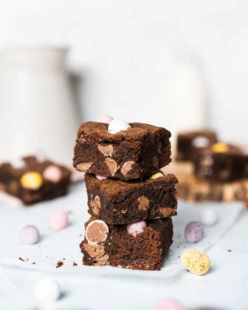 Rich fudgy brownies filled and topped with delightfully crunchy mini eggs. Recipe by movers and bakers