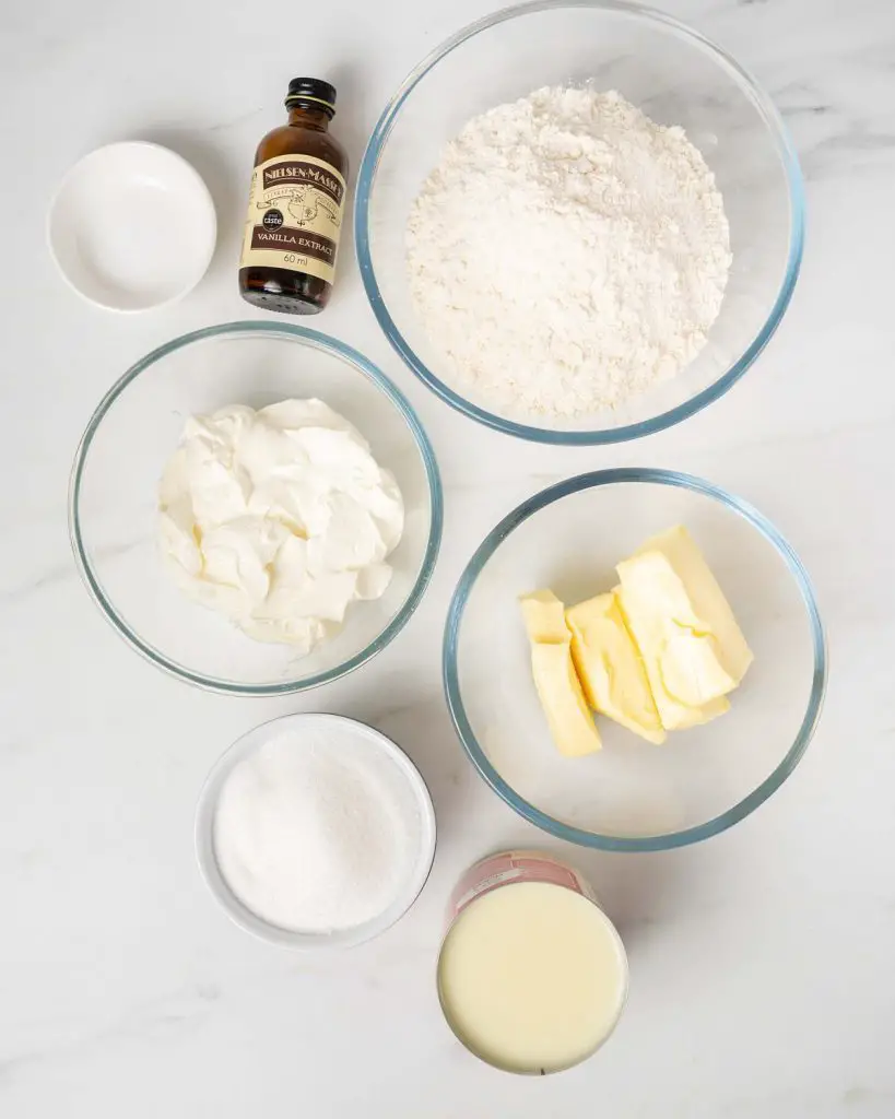 Ingredients for the base and cheesecake topping: unsalted butter, plain (all purpose) flour, granulated sugar, vanilla, salt, cream cheese and condensed milk. Recipe by movers and bakers
