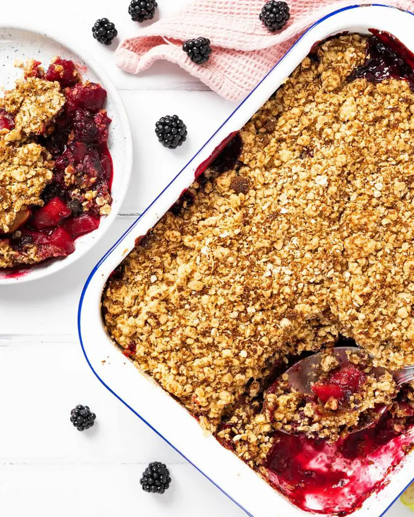 Apple and blackberry crumble. A delicious autumnal favourite, with the stunning combination of seasonal apples and blackberries topped with a crunchy crumble topping. Perfect served with cream, ice cream or custard, or just enjoyed on its own. Recipe by movers and bakers
