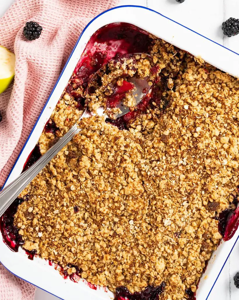 Apple and blackberry crumble. A delicious autumnal favourite, with the stunning combination of seasonal apples and blackberries topped with a crunchy crumble topping. Perfect served with cream, ice cream or custard, or just enjoyed on its own. Recipe by movers and bakers