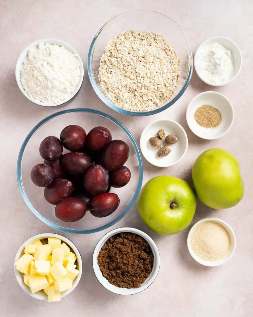 Ingredients required: oats, plain (all purpose) flour, unsalted butter, dark muscovado sugar, apples, plums, cornflour, caster sugar, nutmeg and cardamom. Recipe by movers and bakers