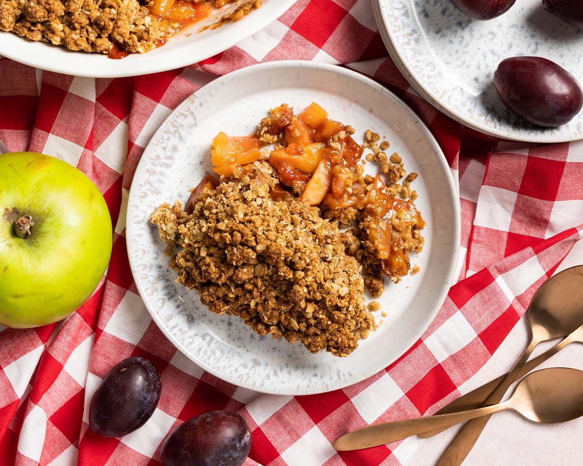 Plum and apple crumble. Hearty, cosy and so simple to make, my plum and apple crumble will warm your belly and satisfy your tastebuds! A firm family favourite! Recipe by movers and bakers