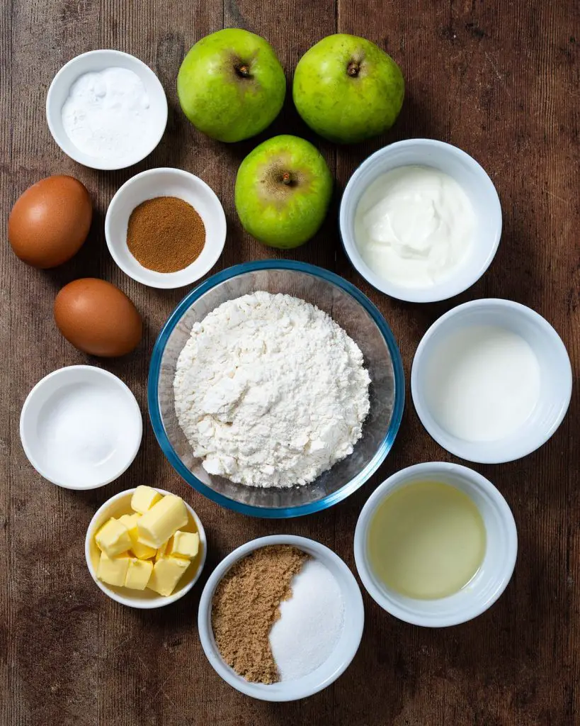 Ingredients required: apples, brown sugar, plain (all purpose) flour, cinnamon, unsalted butter, baking powder, bicarbonate of soda (baking soda), salt, oil, caster sugar, eggs, yogurt and milk. Recipe by movers and bakers