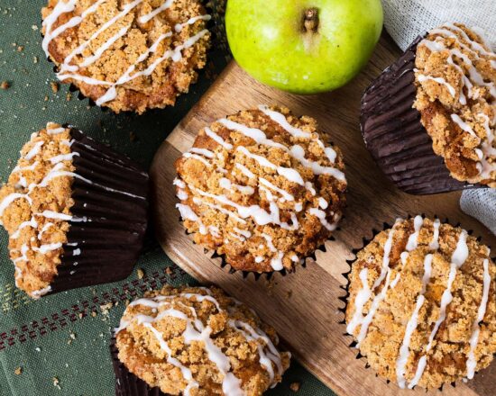 Apple cinnamon muffins. Tender and moist muffins packed with apple and cinnamon flavour topped with a beautiful crunchy cinnamon streusel topping. Recipe by movers and bakers