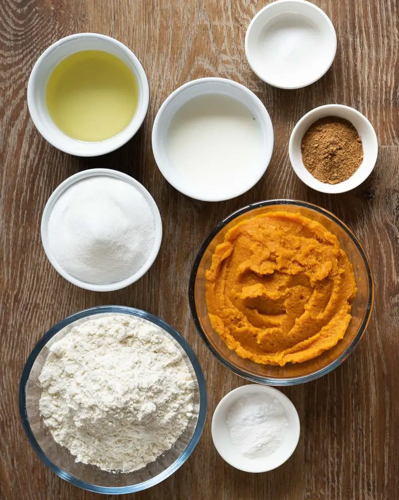 Ingredients required for the loaf: plain (all purpose) flour, caster sugar, baking powder, bicarbonate of soda (baking soda), pumpkin pie spice, salt, vanilla (not pictured), milk, oil and pumpkin puree. Recipe by movers and bakers