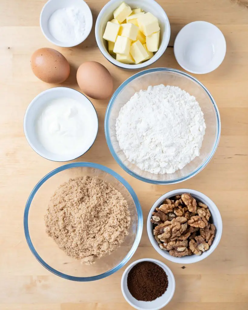 Ingredients for the cake: unsalted butter, brown sugar, plain (all purpose) flour, baking powder, bicarbonate of soda (baking soda), salt, eggs, yogurt, coffee and walnuts. Recipe by movers and bakers