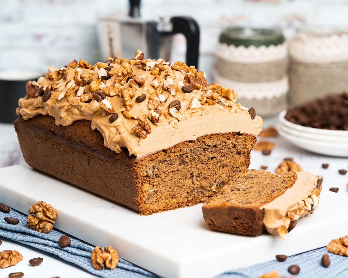 Coffee and walnut loaf. A wonderfully rich coffee flavoured cake, studded with walnuts is topped with a perfectly sweet coffee frosting and a generous sprinkling of walnuts to finish. Heavenly coffee cake! Recipe by movers and bakers