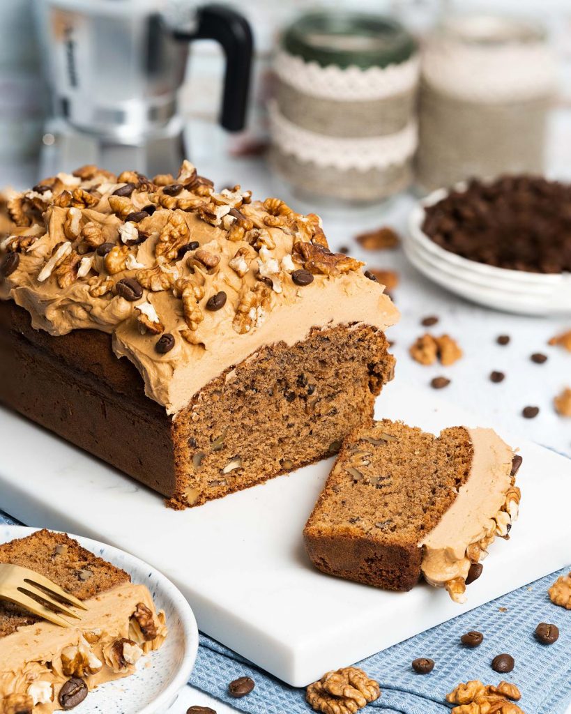 Coffee and walnut loaf. A wonderfully rich coffee flavoured cake, studded with walnuts is topped with a perfectly sweet coffee frosting and a generous sprinkling of walnuts to finish. Heavenly coffee cake! Recipe by movers and bakers