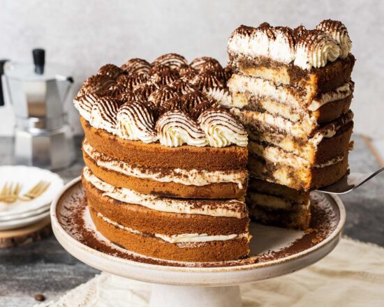 Tiramisu cake. Taking all the classic flavours of the traditional Italian dessert and bringing it into a cake no one can resist! Recipe by movers and bakers