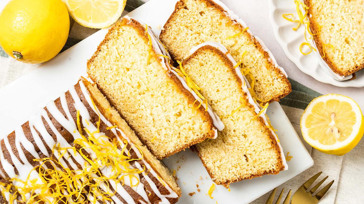 Easy lemon drizzle cake. A light and fluffy cake packed with plenty of delicious zingy lemon flavour, topped with a sweet lemon drizzle. A perfect tea time treat! Recipe by movers and bakers
